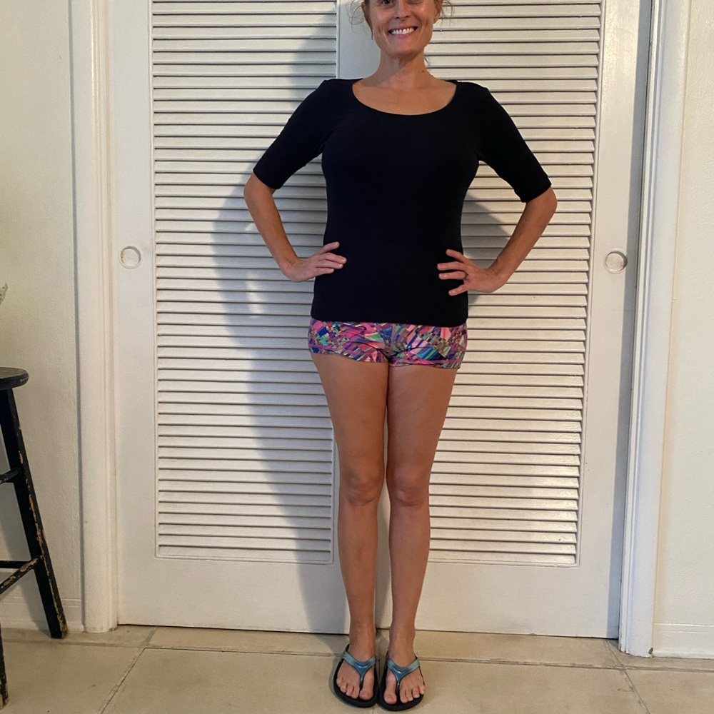 Stylish Black Top with Colorful Patterned Shorts
